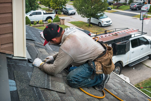 Professional Roofing technician working in South Walpole, MA
